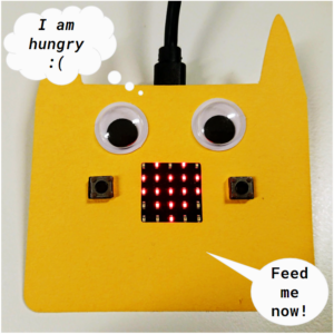 CyberPet yellow case over micro:bit in the shape of a creature