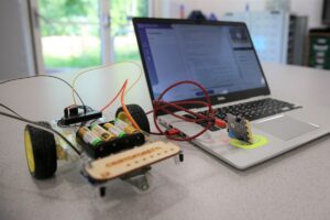Micro:bit robot with wheels connected to laptop