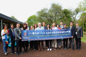 Group of people holding a banner