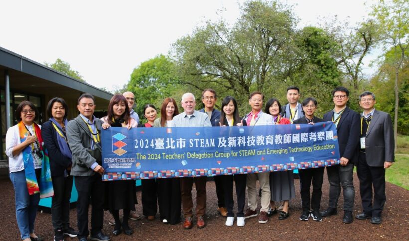 Group of people holding a banner