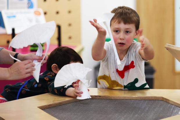 Child at the air table
